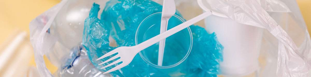 Plastic waste with plastic utensils, plastic wrapping, plastic container
