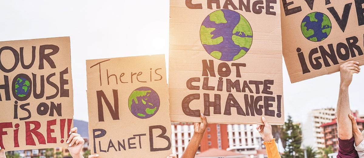 Protest with signs being held for climate action and climate change